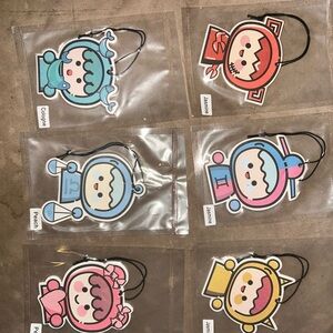 Airfreshners and a pack of colorful ties